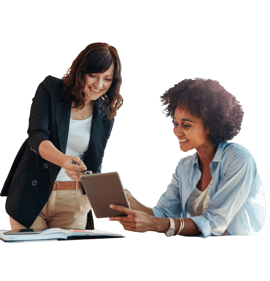 Two women collaborating over a tablet in an office