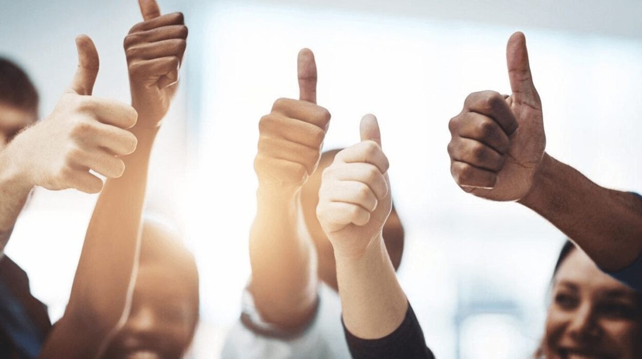 happy team showing thumbs up symbol.