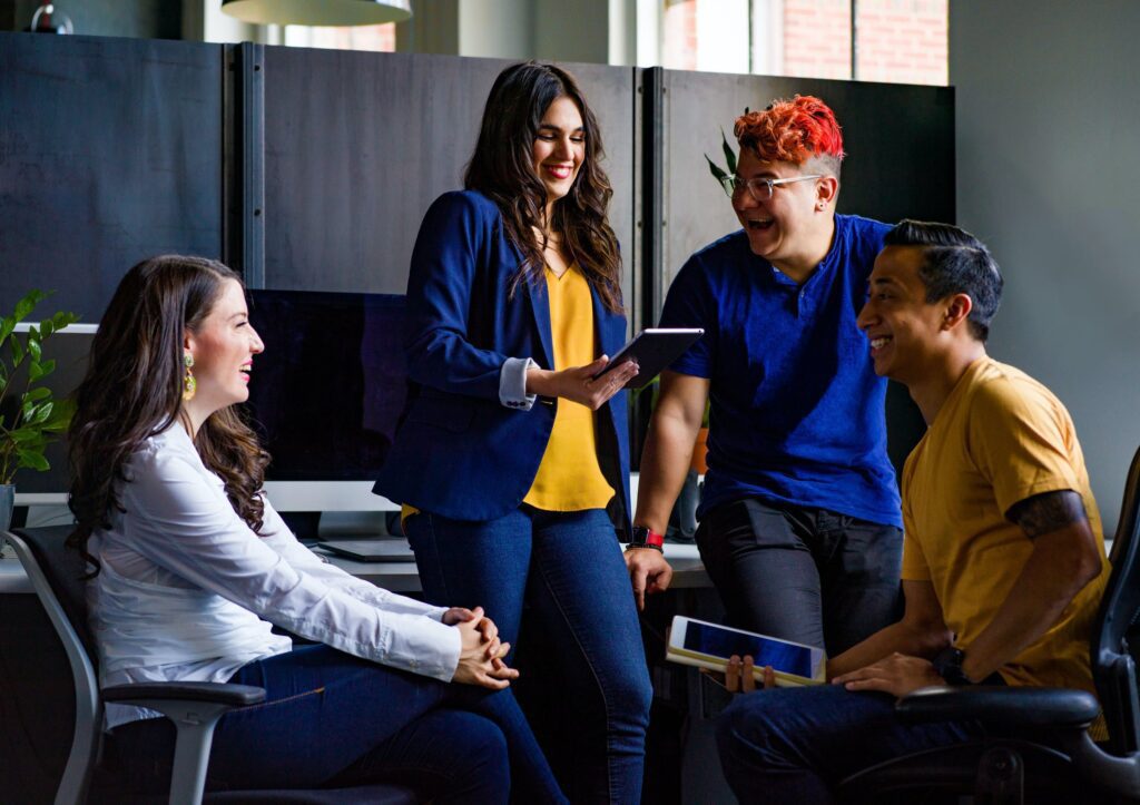 Happy employees sharing smiles after having better onboarding