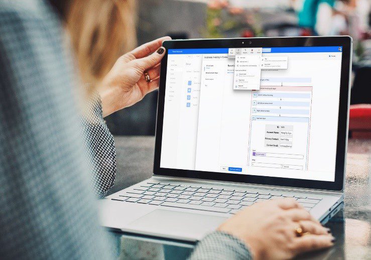 female employee working Microsoft Power Platform RPA with laptop