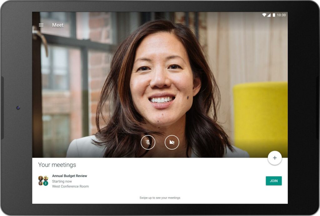 female employee face on tablet screen during attending meeting