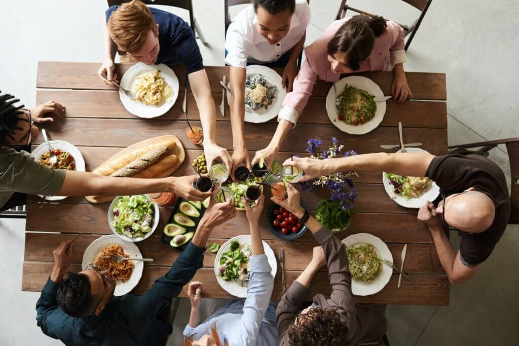 different culture employees celebrating lunch gathering.