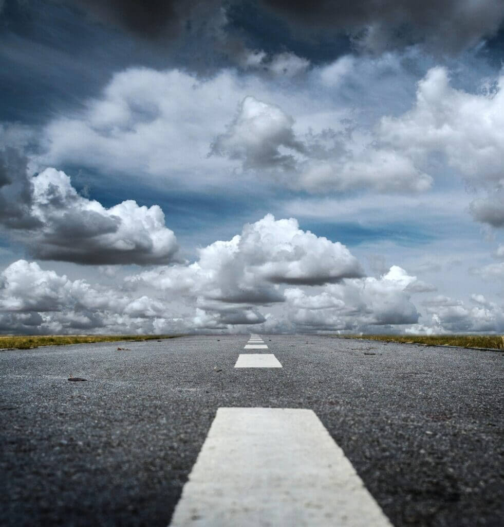 empty road with clouds 