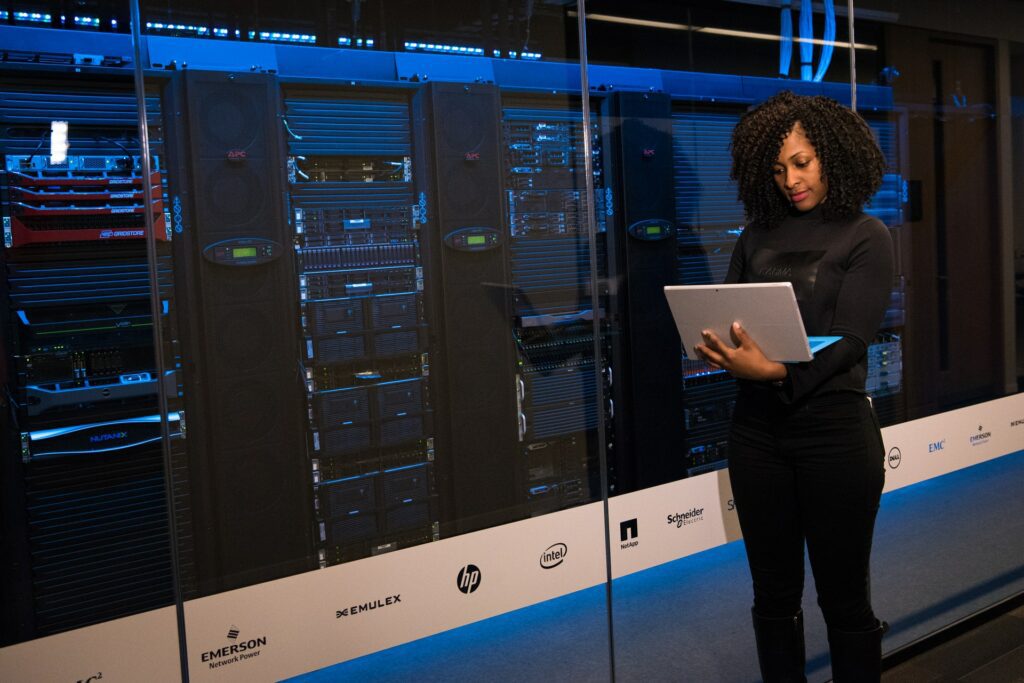 woman on laptop in front of ai computing services