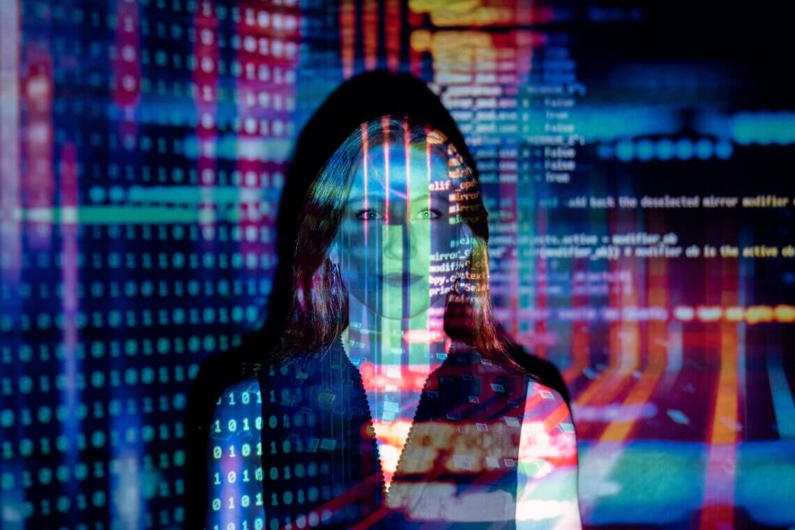 woman behind computer screen