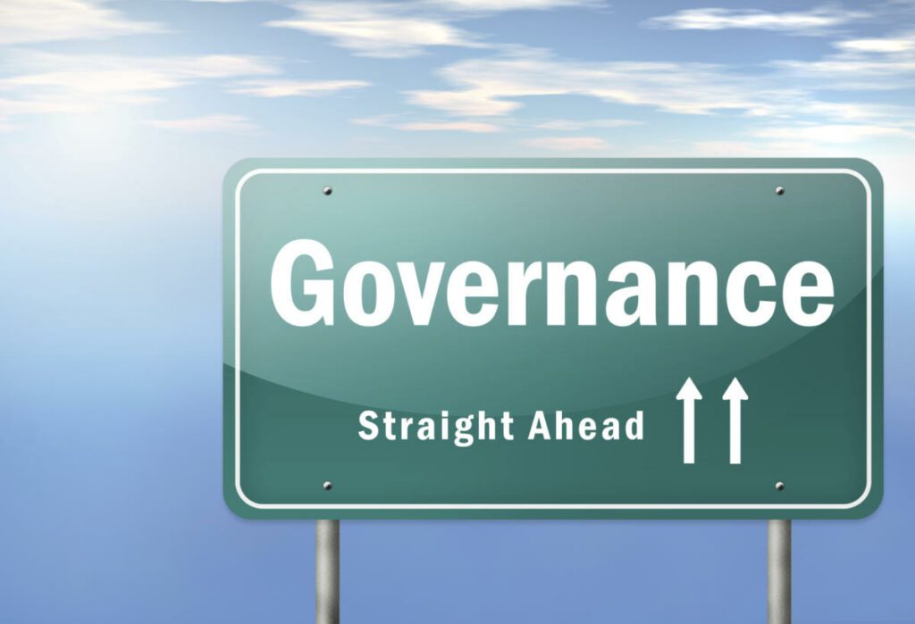 Governance word written in white colour on green background colour board.