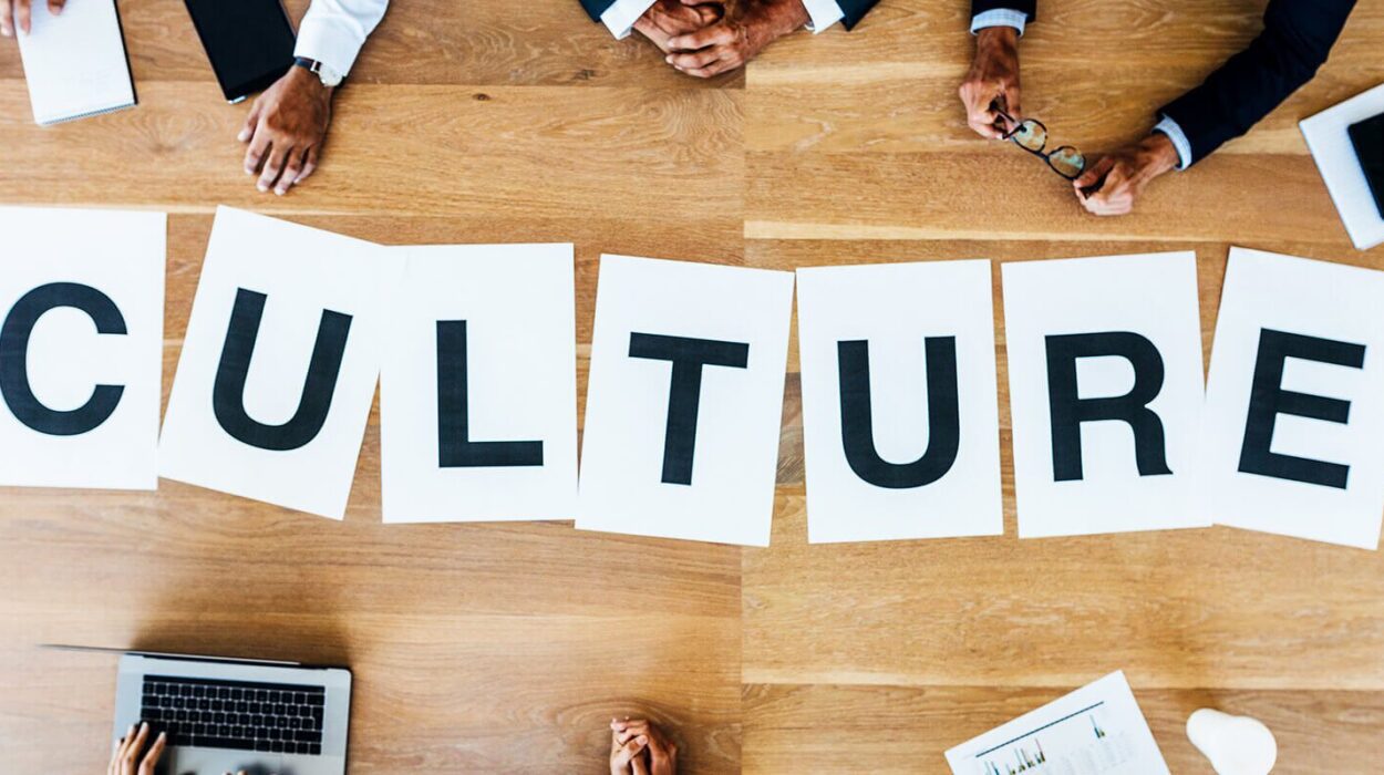 top view of Culture word, employees hands and laptops.