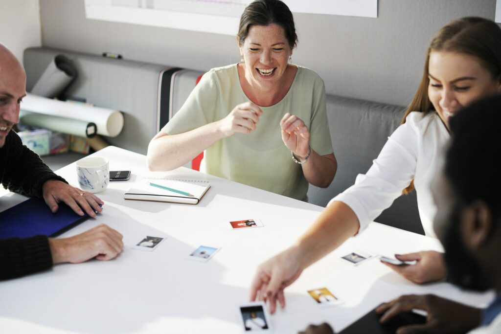 Happy employees sharing photo cards