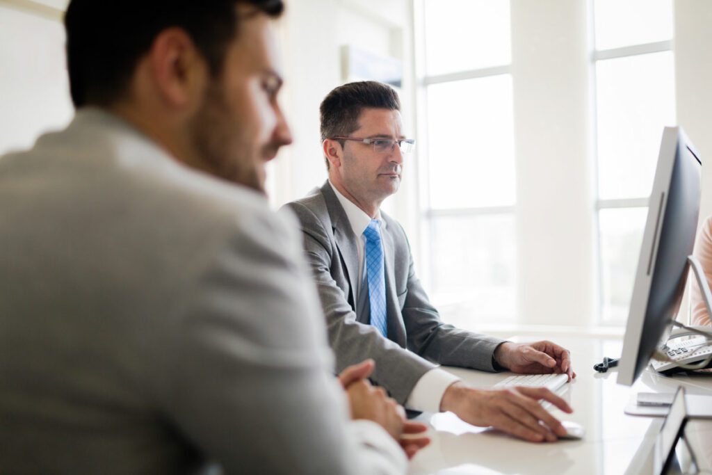 IT Business Leaders working on Microsoft Azure with Desktop from office