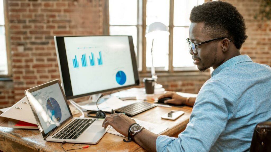 employee working on laptop on low code application