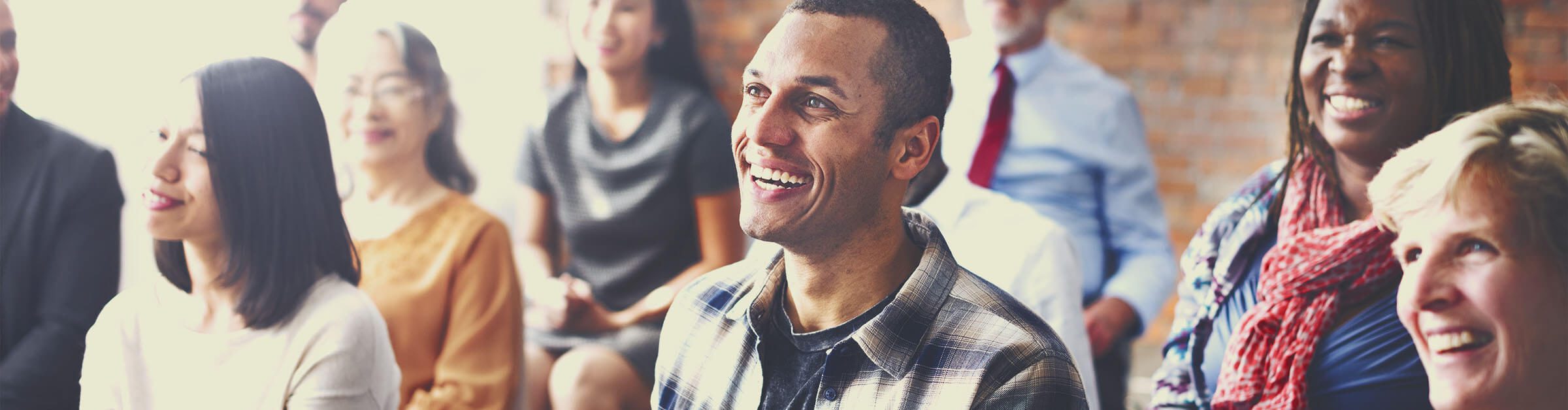 a man smiling after successfully implementing business innovation