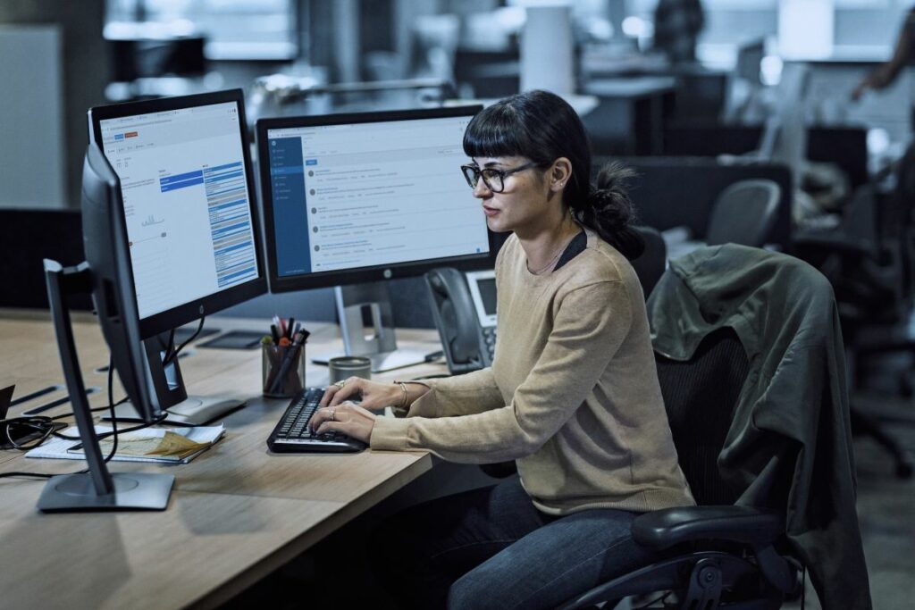 a woman working on computer trying to figure out how to simplify logins with security assertion markup language