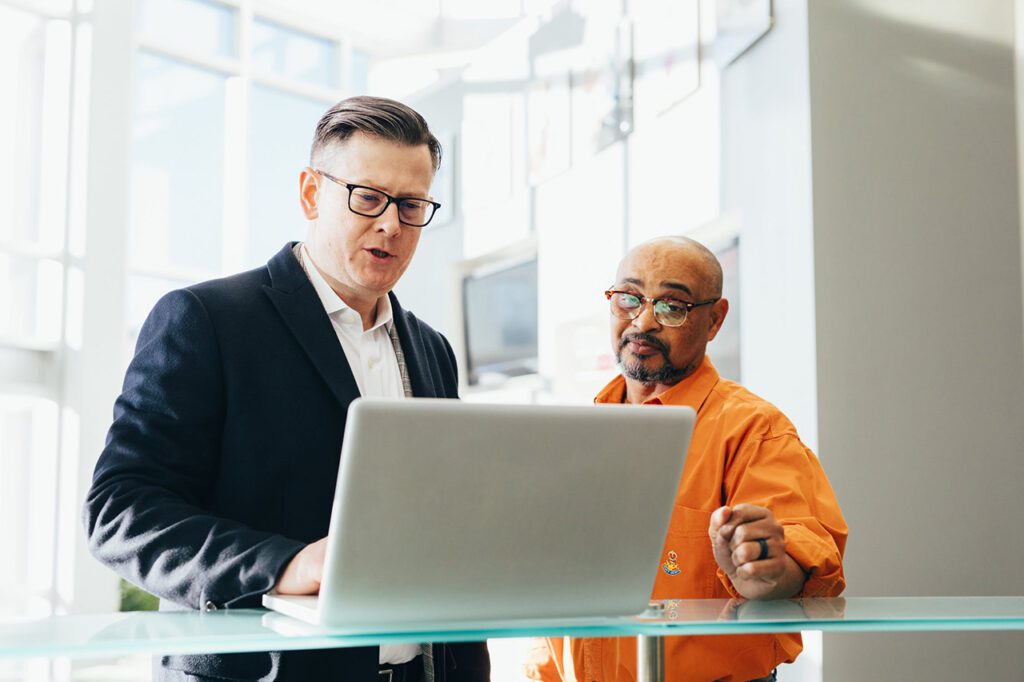 Businessman checking data breach methods with laptop from office