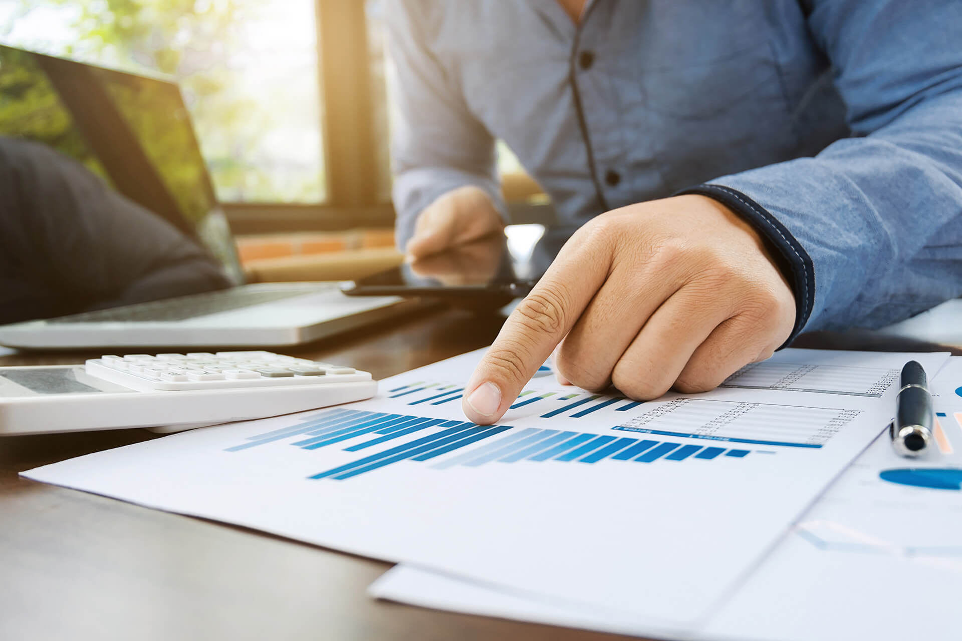 man checking quality assurance reports