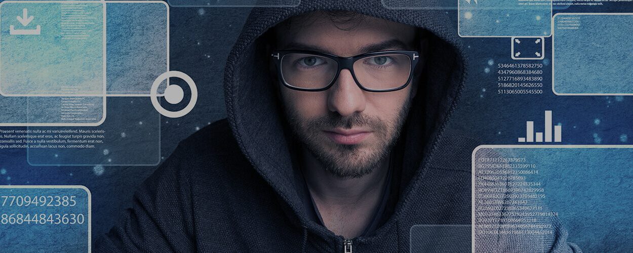 man wearing glasses and hoodie working on protection from data breach