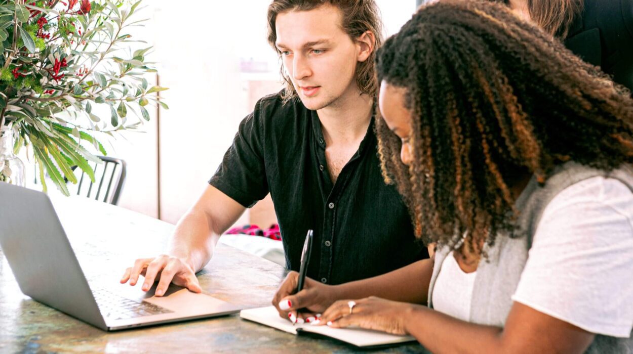 Man showing his laptop screen to colleagues about automation software