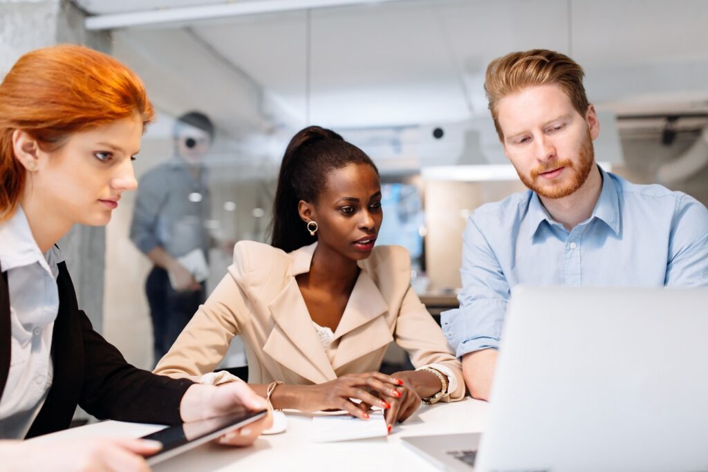 three people discussing process automation