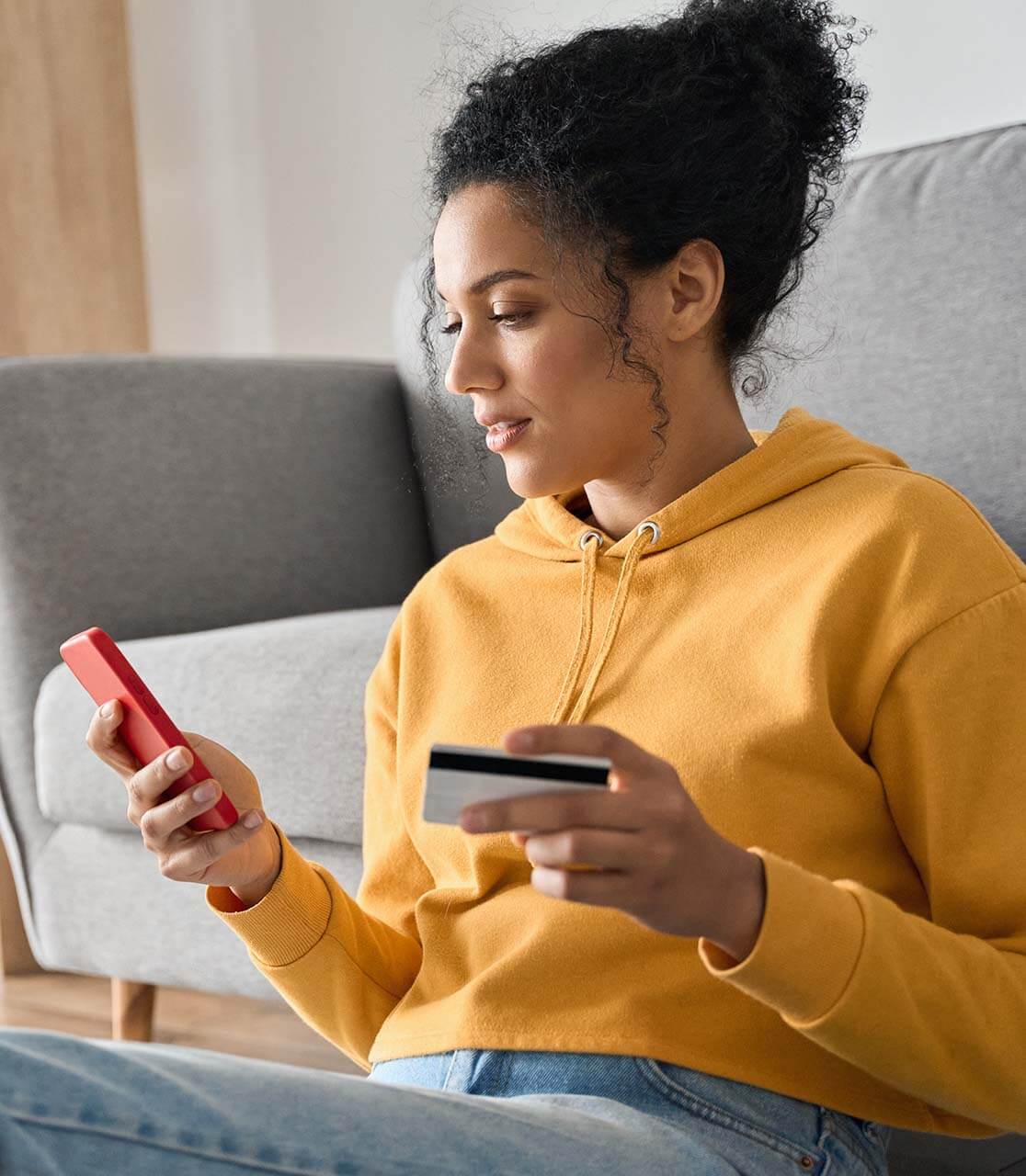 woman using her bank card to process payment