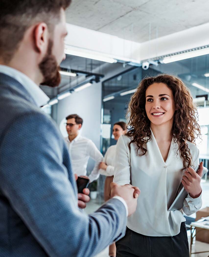 insurance experts shaking hands upon meeting