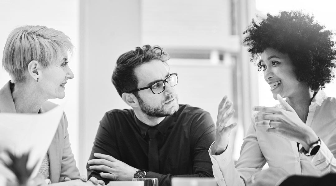 man and two women discussing security pen testing