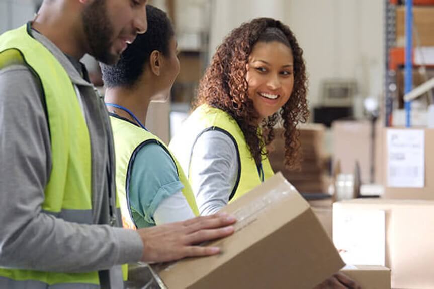 a man and women packing boxes