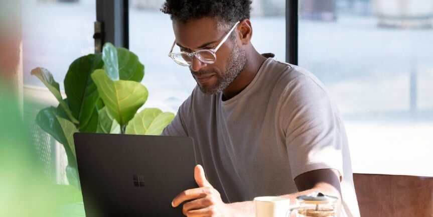 A man looking at the laptop